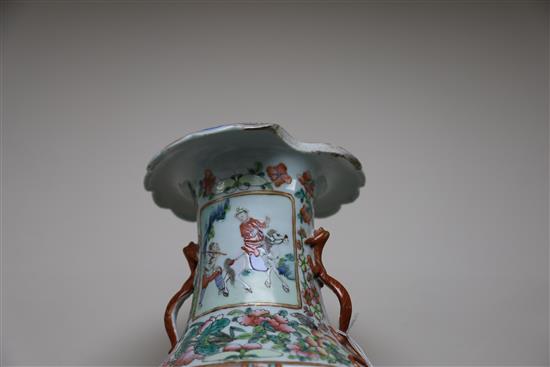 A pair of Chinese famille rose vases, 19th century, H. 45cm, one with section of rim lacking